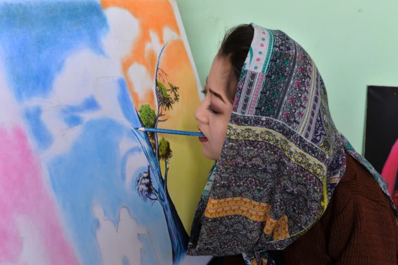 Afghan artist brushes aside disability to open arts centre